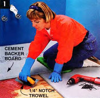 Use a square-notch trowel to spread the adhesive and glue the cement board