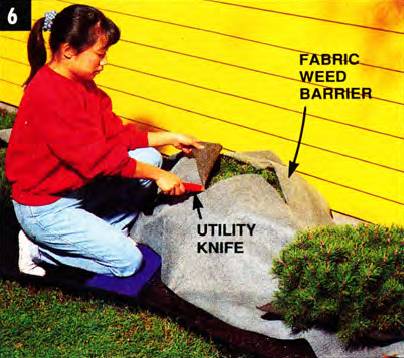 Use a utility knife to cut the fabric weed barrier