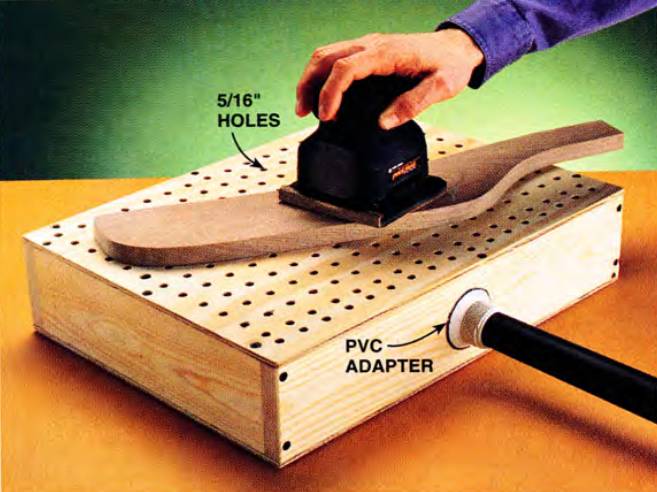 Nail a simple box together and make your own downdraft table to get rid of dust, once and for all
