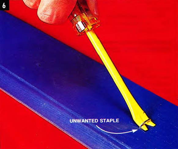 use a tack and staple remover to get rid of unwanted staples